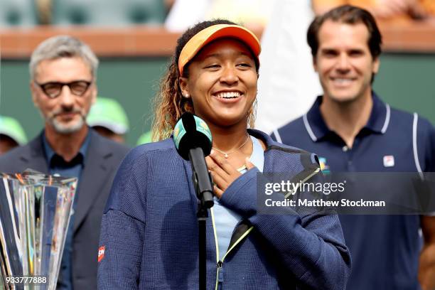 Naomi Osaka of Japan addreses the audiance at the trophy ceremony after defeating Daria Kasatkina of Russia during the women's final on Day 14 of the...