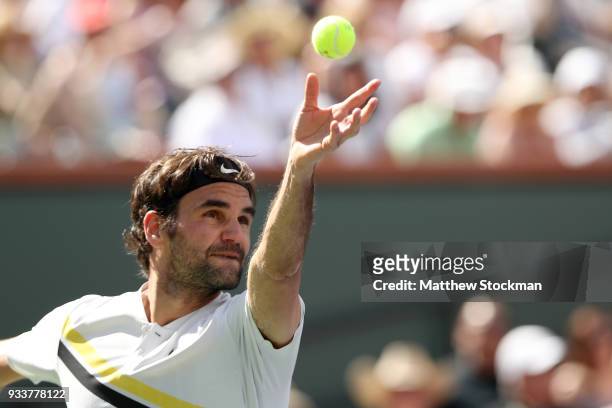 Roger Federer of Switzerland serves to Juan Martin Del Potro of Argentina during the men's final on Day 14 of the BNP Paribas Open at the Indian...