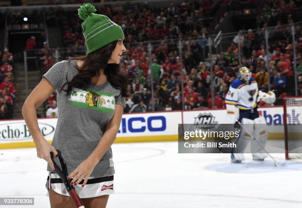 Member of the Chicago Blackhawks ice-crew scrapes the ice during the game between the Chicago Blackhawks and the St. Louis Blues at the United Center...