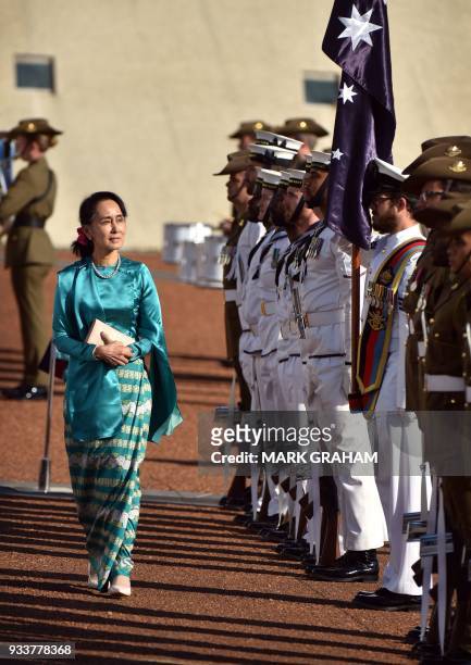 Myanmar's State Counsellor Aung San Suu Kyi receives an official welcome on the forecourt during her visit to Parliament House in Canberra on March...