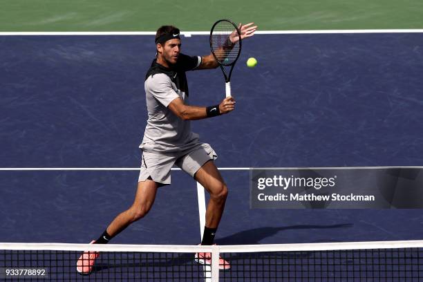 Juan Martin Del Potro of Argentina returns a shot to Roger Federer of Switzerland during the men's final on Day 14 of the BNP Paribas Open at the...