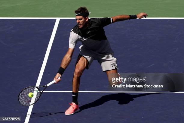 Juan Martin Del Potro of Argentina returns a shot to Roger Federer of Switzerland during the men's final on Day 14 of the BNP Paribas Open at the...
