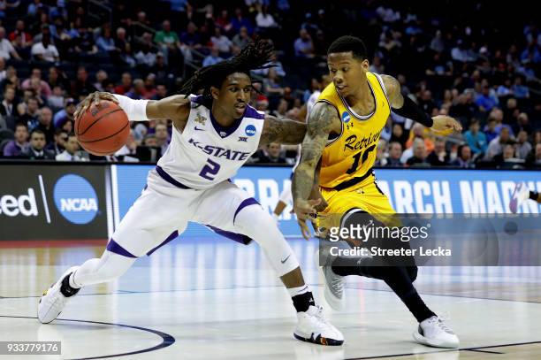 Jairus Lyles of the UMBC Retrievers defends Cartier Diarra of the Kansas State Wildcats during the second round of the 2018 NCAA Men's Basketball...