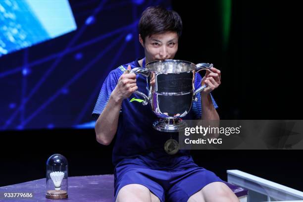 Shi Yuqi of China poses with his trophy after winning the Men's singles final match against Lin Dan of China on day five of the YONEX All England...