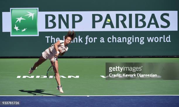 Daria Kasatkina of Russia serves against Naomi Osaka of Japan during the women's final on Day 14 of BNP Paribas Open on March 18, 2018 in Indian...