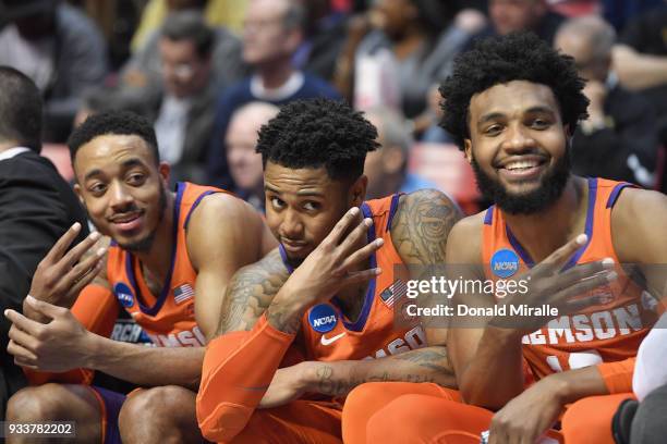 Marcquise Reed, Shelton Mitchell and Gabe DeVoe of the Clemson Tigers celebrate on the bench as they take on the Auburn Tigers in the second half...