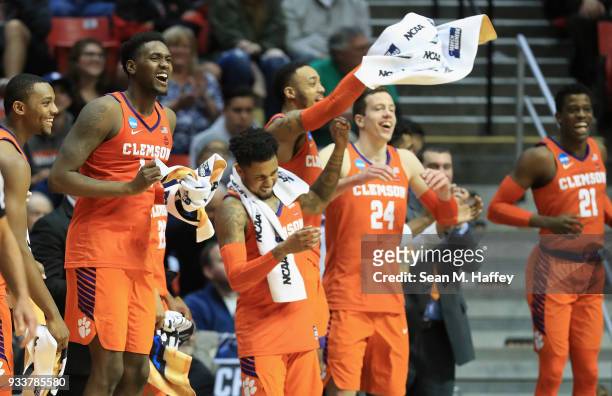 Aamir Simms, Elijah Thomas, Shelton Mitchell, Marcquise Reed, David Skara and Anthony Oliver II of the Clemson Tigers celebrate on the bench as they...