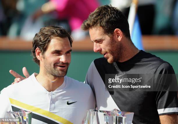 Juan Martin Del Potro with Roger Federer after Del Potro defeated Federer to become the 2018 BNP Paribas Open Champion after a finals match played on...