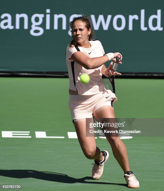 Daria Kasatkina of Russia returns against Naomi Osaka of Japan during the women's final on Day 14 of BNP Paribas Open on March 18, 2018 in Indian...
