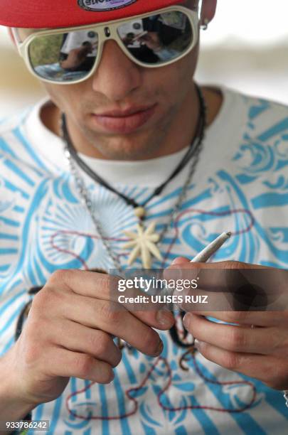 Man rolls a joint during the first Cannabis Cup where self-cultivation and the quality of the herb are encouraged, in Tlajomulco de Zuniga, Jalisco...