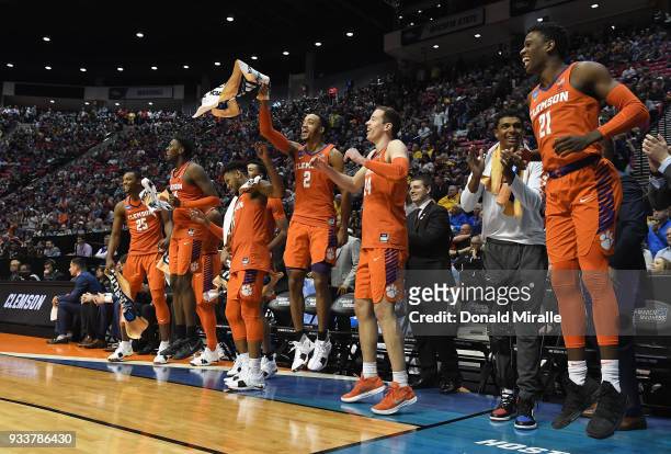 Aamir Simms, Elijah Thomas, Shelton Mitchell, Marcquise Reed, David Skara and Anthony Oliver II of the Clemson Tigers celebrate on the bench as they...