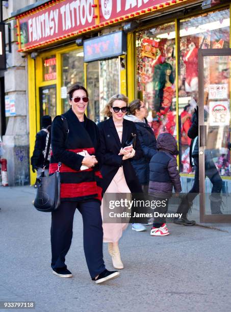 Naomi Watts and friend share a laugh while walking past Fantasy Party adult store on March 18, 2018 in New York City.