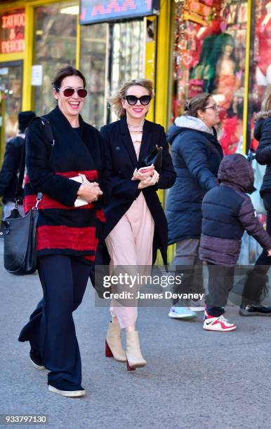 Naomi Watts and friend share a laugh while walking past Fantasy Party adult store on March 18, 2018 in New York City.