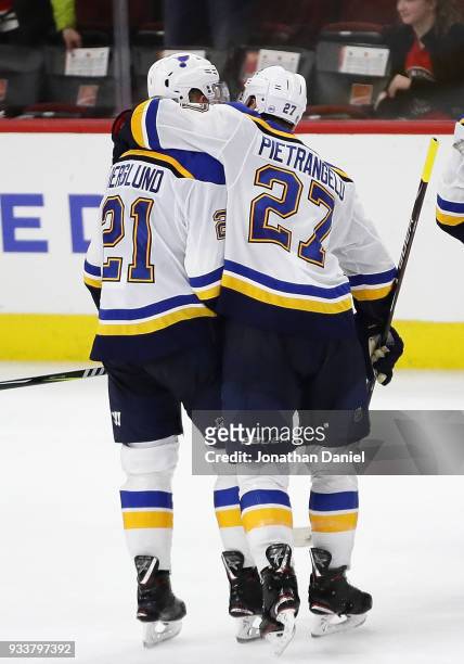 Alex Pietrangelo of the St. Louis Blues hugs Patrik Berglund after Berglund scored the game-winning goal in overtime against the Chicago Blackhawks...
