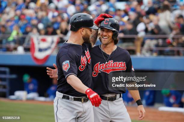 Mike Napoli and Drew Maggi of the Indians celebrate after Napoli hit a home run during a game between the Chicago Cubs and Cleveland Indians as part...