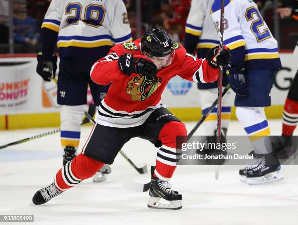 Alex DeBrincat of the Chicago Blackhawks celebrates after scoring his third goal of the game for a hat trick against the St. Louis Blues at the...