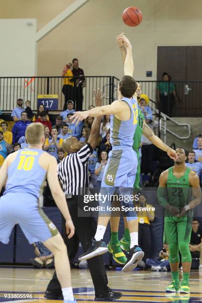 Marquette Golden Eagles center Matt Heldt jumps for the opening tip during a National Invitation Tournament game between the Marquette Golden Eagles...