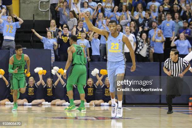 Marquette Golden Eagles forward Jamal Cain celebrates his three point basket during a National Invitation Tournament game between the Marquette...