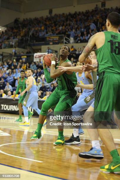 Oregon Ducks forward MiKyle McIntosh drives the lane during a National Invitation Tournament game between the Marquette Golden Eagles and the Oregon...