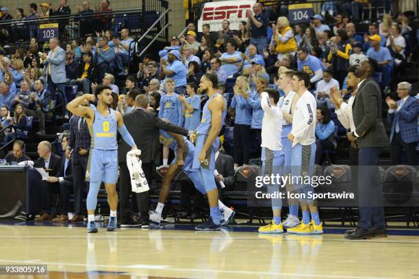 Marquette Golden Eagles bench celebrate during a National Invitation Tournament game between the Marquette Golden Eagles and the Oregon Ducks at the...