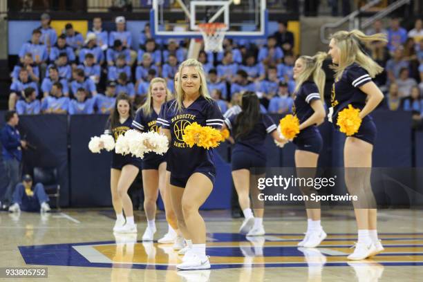 The Marquette Golden Eagles dance team perform during a National Invitation Tournament game between the Marquette Golden Eagles and the Oregon Ducks...