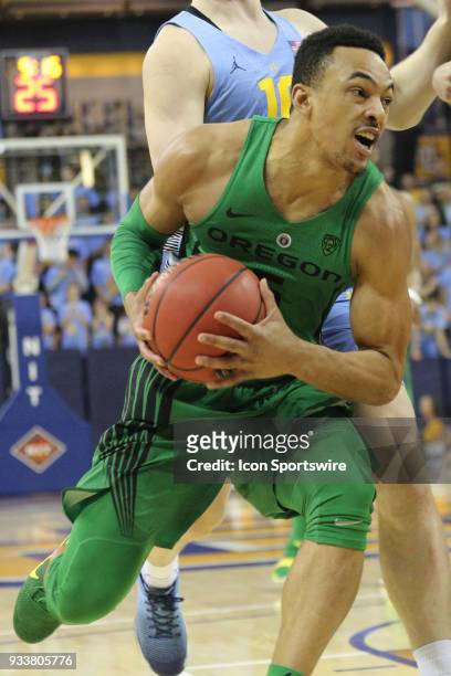 Oregon Ducks guard Elijah Brown drives into traffic during a National Invitation Tournament game between the Marquette Golden Eagles and the Oregon...