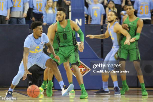 Marquette Golden Eagles guard Sacar Anim dribbles during a National Invitation Tournament game between the Marquette Golden Eagles and the Oregon...