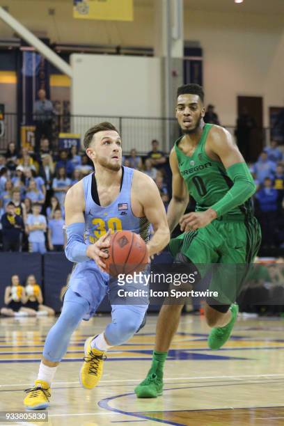 Marquette Golden Eagles guard Andrew Rowsey drives during a National Invitation Tournament game between the Marquette Golden Eagles and the Oregon...