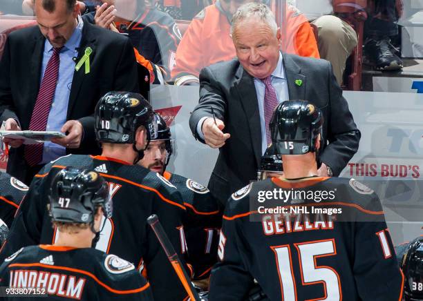 Head coach Randy Carlyle of the Anaheim Ducks gives direction to his players during the second period of the game against the New Jersey Devils at...