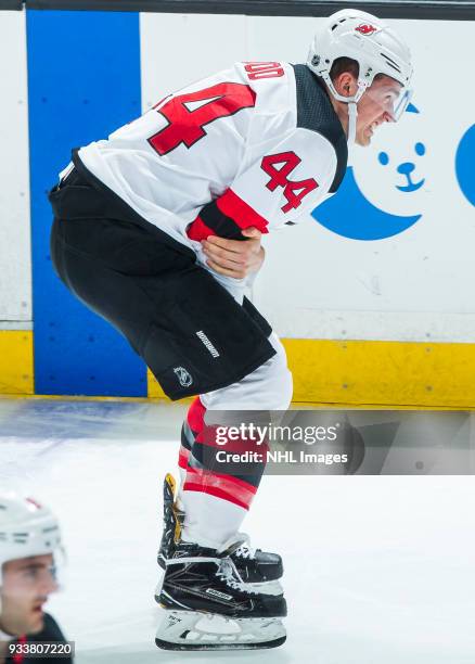 Miles Wood of the New Jersey Devils reacts as he leaves the ice with an injury during the second period of the game against the Anaheim Ducks at...