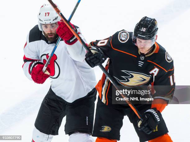 Patrick Maroon of the New Jersey Devils and Corey Perry of the Anaheim Ducks battle for position during the second period of the game at Honda Center...