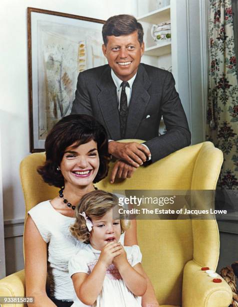 Portrait of, from left, American politician John F Kennedy , Jacqueline Kennedy , and their daughter, Caroline, Hyannis Port, Massachusetts, late...
