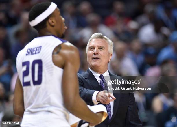 Head coach Bruce Weber of the Kansas State Wildcats speaks to Xavier Sneed during the game against the UMBC Retrievers in the second round of the...