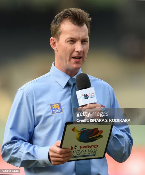 In this photograph taken on March 16 former Australian cricketer Brett Lee gives some TV commentary during the sixth Twenty20 international cricket...