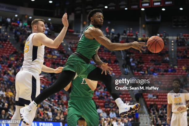 Burks of the Marshall Thundering Herd passes against the West Virginia Mountaineers in the second half during the second round of the 2018 NCAA Men's...