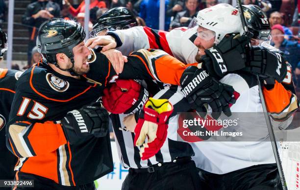 Ryan Getzlaf of the Anaheim Ducks and Patrick Maroon of the New Jersey Devils fight during the third period of the game at Honda Center on March 18,...