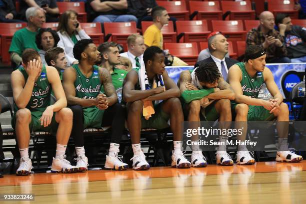 The Marshall Thundering Herd bench reacts as they watch the end of the second half against the West Virginia Mountaineers during the second round of...