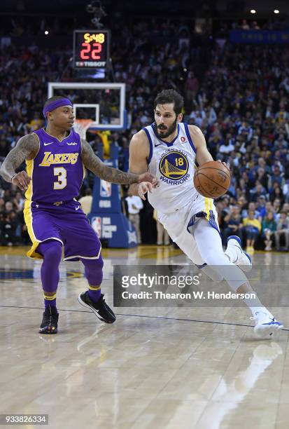 Omri Casspi of the Golden State Warriors drives towards the basket on Isaiah Thomas of the Los Angeles Lakers during an NBA basketball game at ORACLE...