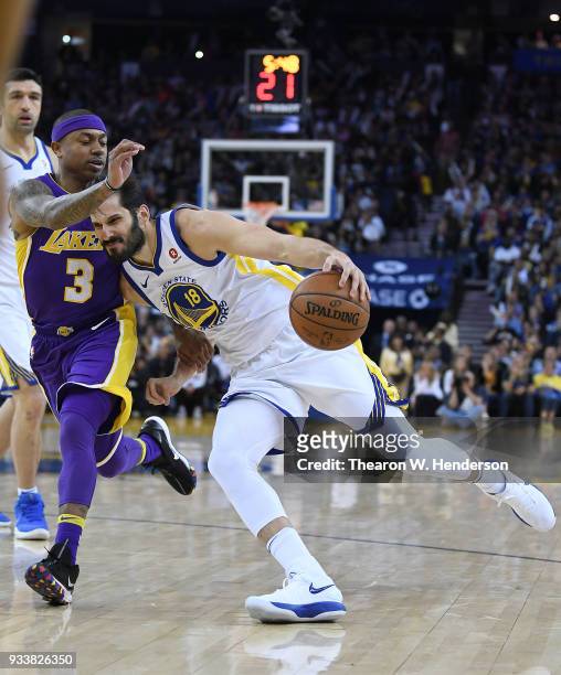 Omri Casspi of the Golden State Warriors drives towards the basket on Isaiah Thomas of the Los Angeles Lakers during an NBA basketball game at ORACLE...
