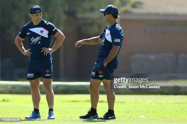 Cooper Cronk of the Roosters talks to Andrew Johns during a Sydney Roosters NRL training session at Kippax Lake on March 19, 2018 in Sydney,...