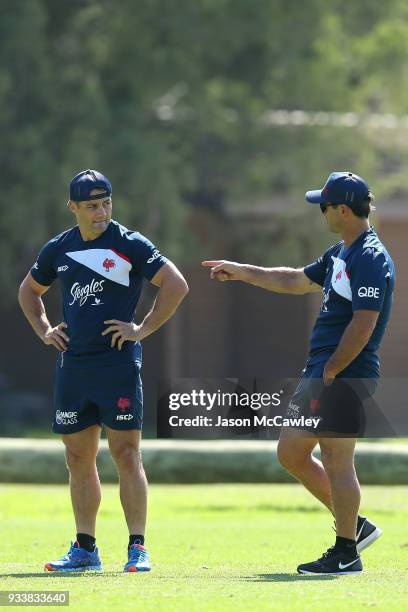 Cooper Cronk of the Roosters talks to Andrew Johns during a Sydney Roosters NRL training session at Kippax Lake on March 19, 2018 in Sydney,...