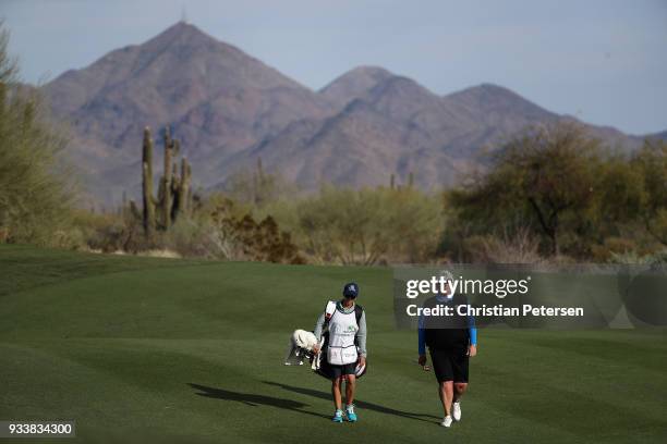 Laura Davies of England walkls with her caddie down the 13th hole during the final round of the Bank Of Hope Founders Cup at Wildfire Golf Club on...