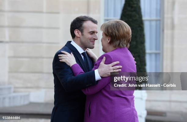 President Emmanuel Macron of France receives German Chancellor Angela Merkel at Elysee Palace on March 16, 2018 in Paris, France. The main issue of...