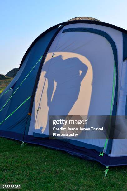 silhouette of a woman in a tent - pembrokeshire camping stock pictures, royalty-free photos & images