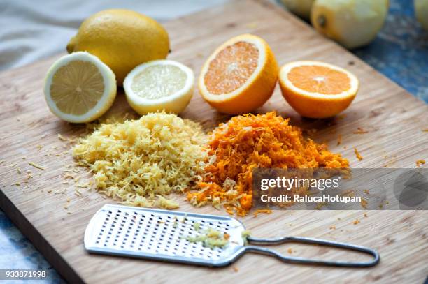 lemon and orange zest - zitruszeste stock-fotos und bilder