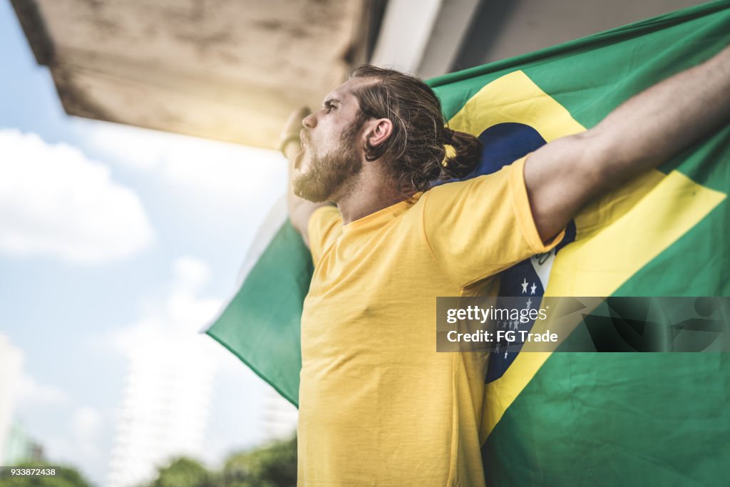 Brazilian fan watching a soccer game