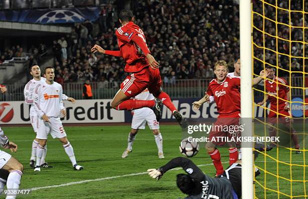 Liverpool's David Ngog scores a goal against Hungarian VSC Debrecen goalkeeper Vukasin Pleksic during the UEFA Champions League football match at the...