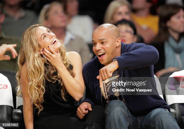 Actor Donald Faison and CaCee Cobb attend a game between the New York Knicks and the Los Angeles Lakers at Staples Center on November 24, 2009 in Los...