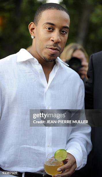 Rapper Chris "Ludacris" Bridges poses on June 21, 2009 as he holds a cocktail made from "Conjure" Cognac, an alcoholic licor whose blend and bouquet...