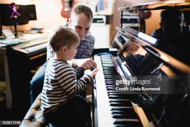 the piano lesson - practicing piano stock pictures, royalty-free photos & images